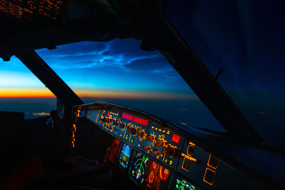 Sentra Airways Plane Cockpit at Dusk - Experience the Thrill of Flight with Our Expertly Trained Pilots
